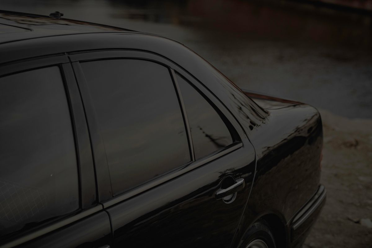 A dark car with tinted side windows