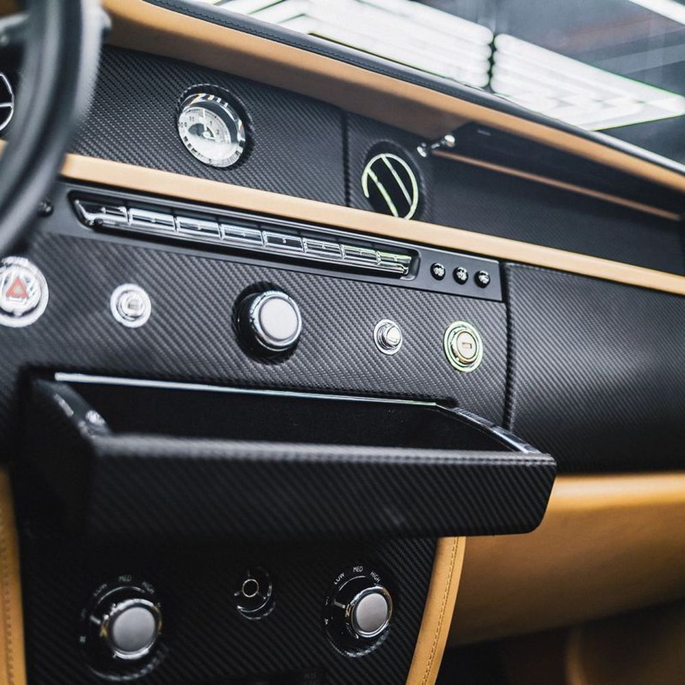 A vehicle dashboard with stereo controls