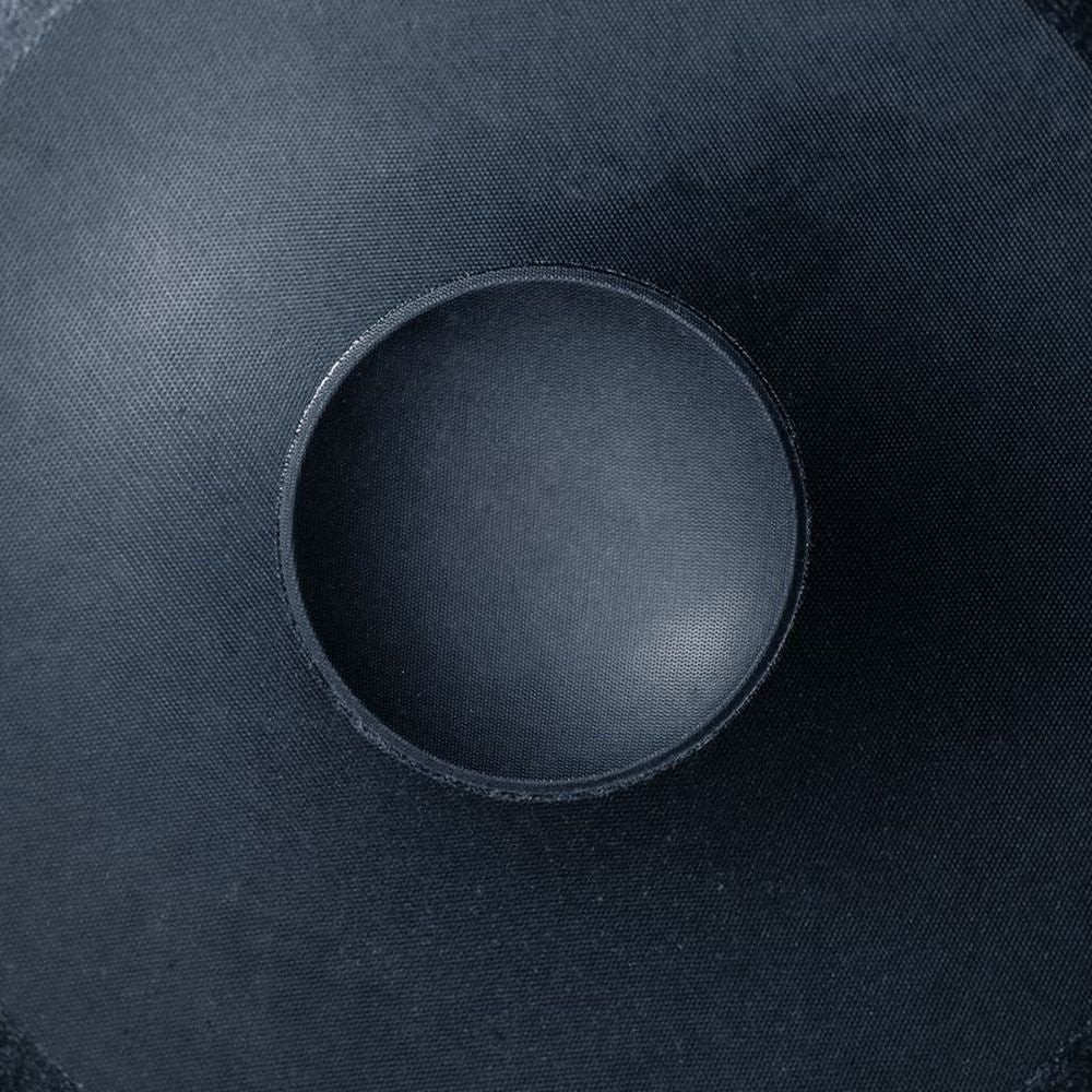 A close-up of a car audio speaker cone