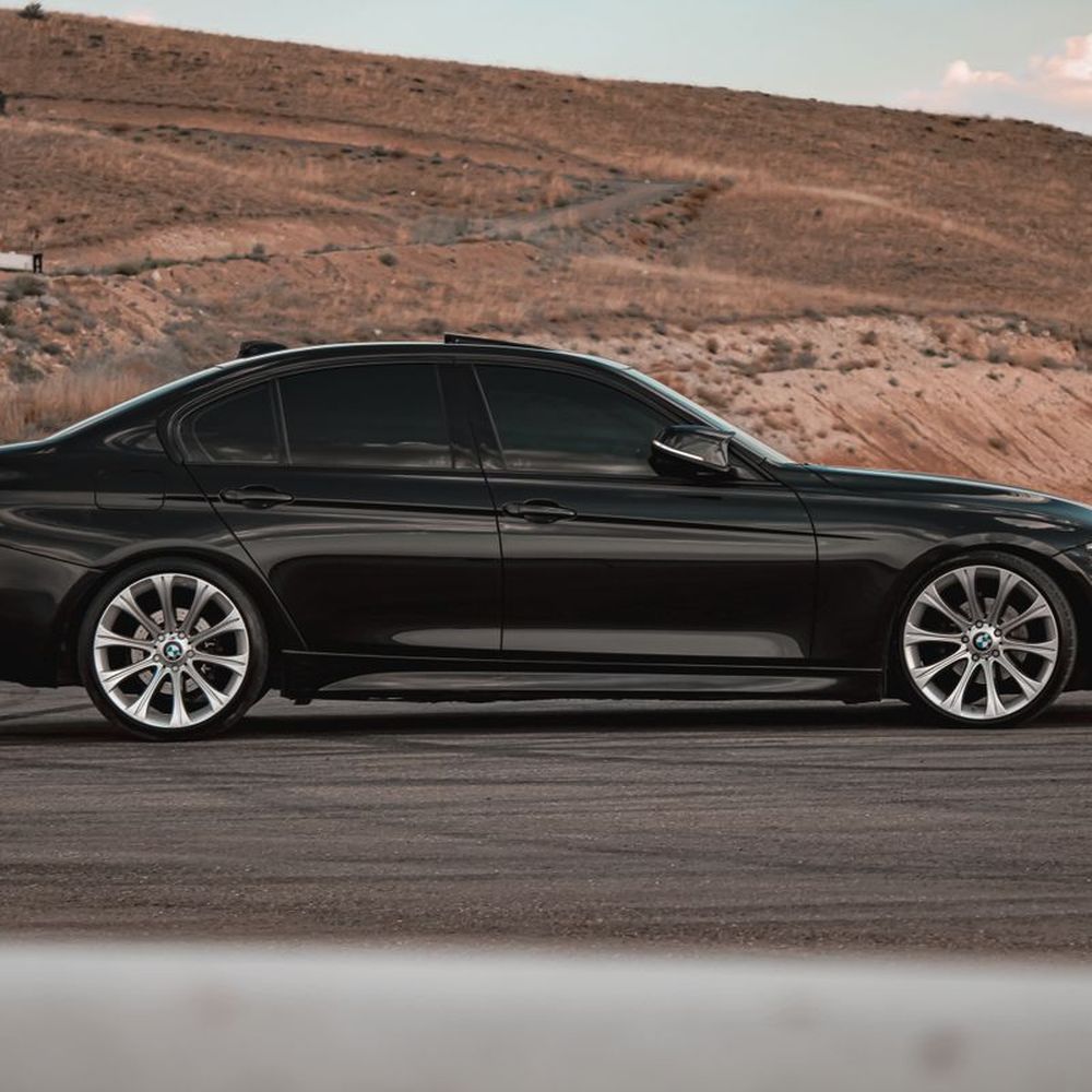 A dark sedan with tinted windows